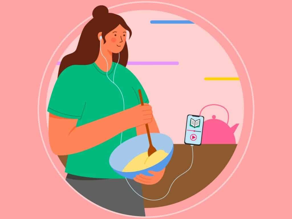 Showing a woman listening to an audible while cooking which helps to improve yourself and stay positive